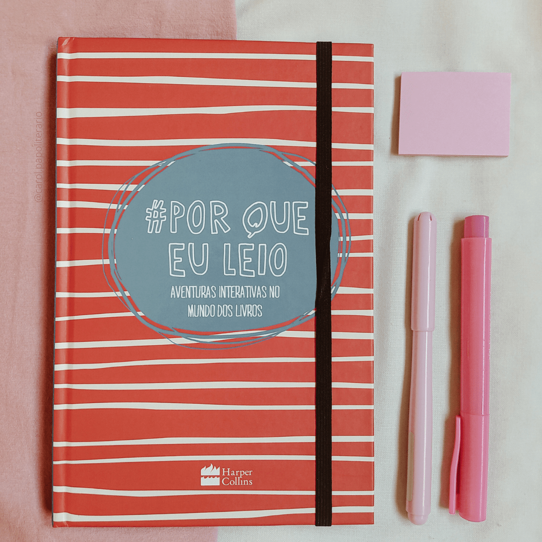 Livro Por que eu leio, com duas canetas rosas e um bloquinho de post-it ao lado.